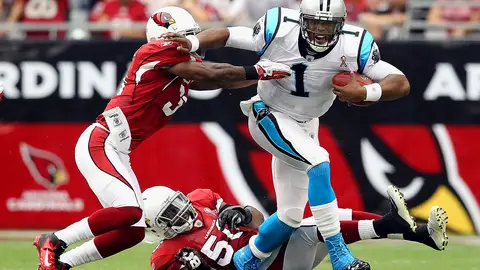 Cam Newton Dazzles in Rookie NFL Year - With his collegiate triumphs and his status as the first player chosen in the 2011 NFL draft, Cam Newton arrived in the pros with higher-than-stratospheric expectations -- call them ionespheric. He did not disappoint. The Carolina Panthers’ prize draft pick set NFL records for most TDs rushing by a quarterback and most yards passing by a rookie.(Photo: Christian Petersen/Getty Images)