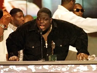 Biggie Smalls to The Notorious B.I.G.  - Christopher Wallace first became Notorious when a copyright claim forced him to drop his original moniker, Biggie Smalls. The new name had a larger-than-life quality that suited him well. (Photo: REUTERS/Fred Prouser)