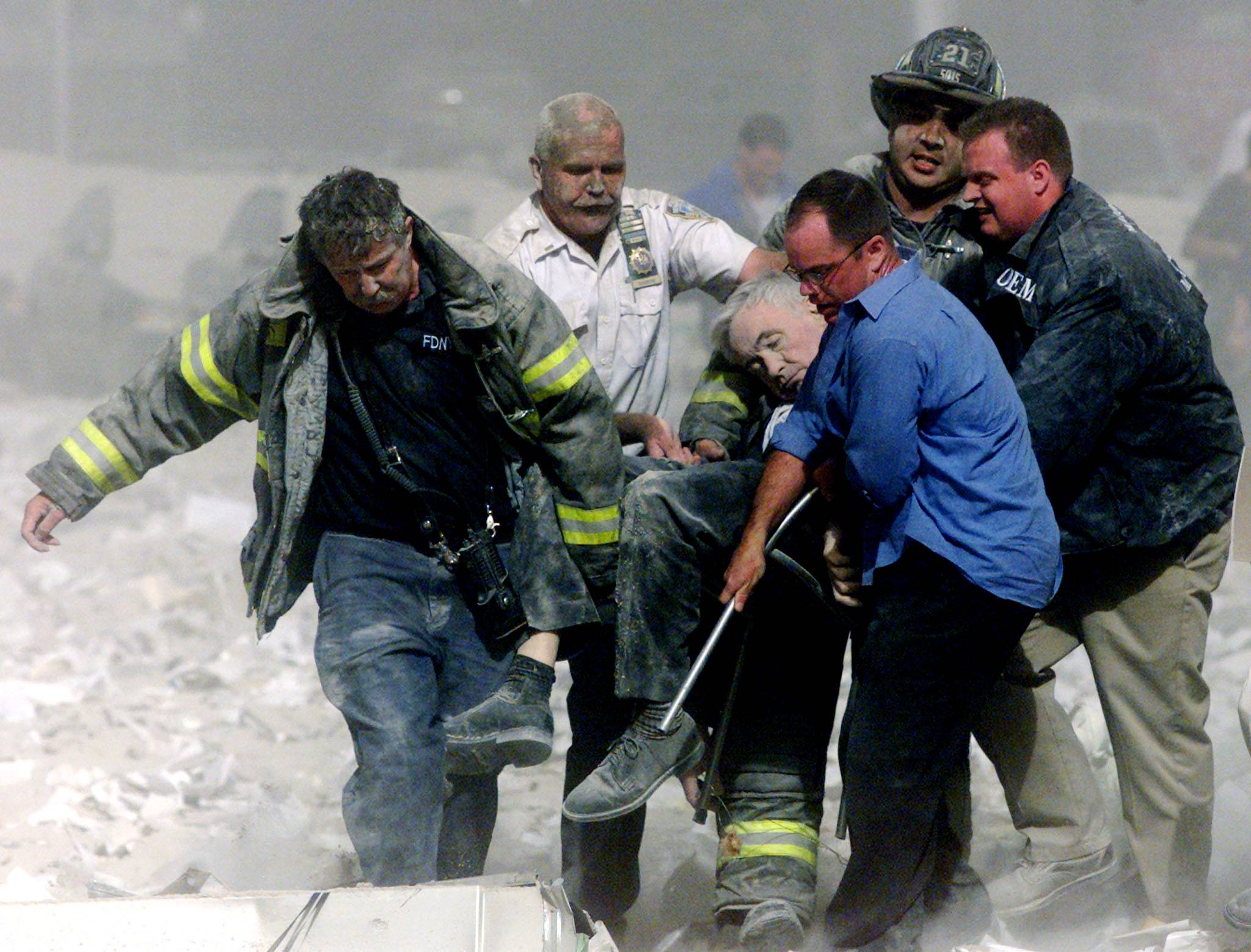 The Rescue - Shortly after the attacks, survivors leave the World Trade Center, but for those who don’t have the ability to &nbsp;leave quickly, firefighters begin their arduous search through the rubble. (Photo: Shannon Stapleton / Reuters)