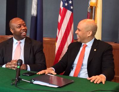 Leading by Example - Sens. Tim Scott (R-South Carolina) and Cory Booker (D-New Jersey) have joined forces to unveil a bill that would encourage businesses to take on apprentices and help boost job opportunities. Though often divided by policy and politics, they've pledged to work together whenever possible. “We’ve found common ground,” said Scott. “I think we’ll find more common ground as we move forward.”  (Photo: Joyce Jones/BET)
