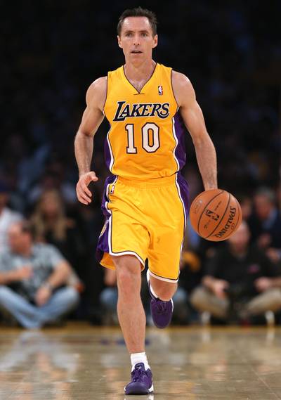 Lakers' Steve Nash to Miss Entire Season - Steve Nash's back injury was definitely worse than the Los Angeles Lakers thought it was. On Friday morning, ESPN reported that the Lakers' veteran point guard will miss the entire 2014-15 season due to re-occurring nerve damage in his back. This comes after the two-time NBA MVP played just 15 games last season. If this marks the end of Nash's career, the point guard will exit the game with career numbers of 14.3 points and 8.5 assists per game.&nbsp;(Photo: Jeff Gross/Getty Images)
