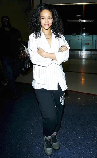 Where Have You Beeeen? - Rihanna's been keeping a low profile in the last few weeks. Here, the pop star&nbsp;arrives at LAX airport in a cozy pair of sweatpants and a big smile.&nbsp;(Photo: Splash News)