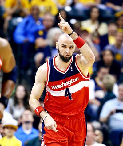 Wizards Re-sign Marcin Gortat - Marcin Gortat was one of the better big men in the NBA last season. Recognizing his effort, the Washington Wizards agreed to a five-year, fully guaranteed $60 million contract with the center on Tuesday night. Wizards star point guard John Wall was happy to learn the news. “Got my man @MGortat back now waitin for my bro @TrevorAriza…Come on!!” Wall tweeted. Gortat, 30, averaged 13.2 points and 9.5 rebounds per game this past season.&nbsp;&nbsp;(Photo: Andy Lyons/Getty Images)