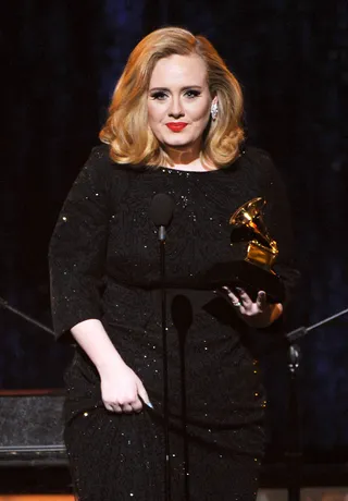 Adele - British chanteuse Adele accepts the Best Pop Solo performance award for her international power ballad “Someone Like You.”&nbsp;(Photo: Kevin Winter/Getty Images)