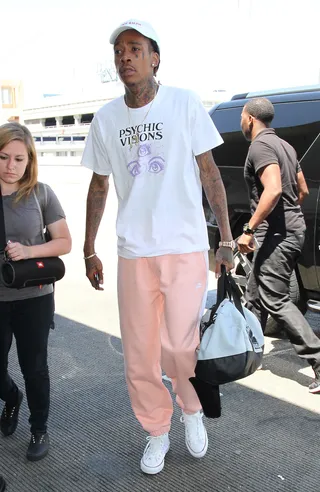 Peachy - Wiz Khalifa looks comfy on his way to catch a flight at LAX.(Photo: WENN.com)