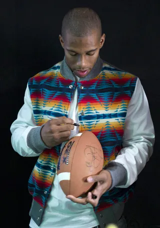 Sign This, Please - Victor Cruz signs an autograph at 106 &amp; Park, January 26, 2012. (Photo: John Ricard / BET)