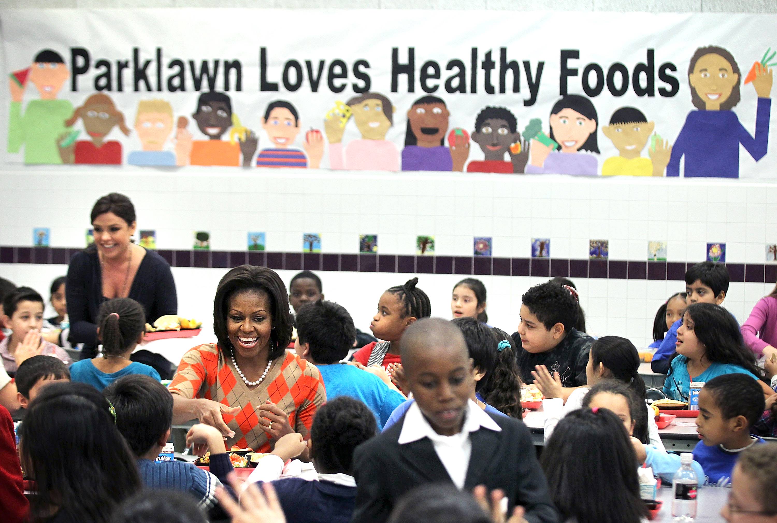 Michelle Obama Announces New School Lunch Nutrition Guidelines - First Lady&nbsp;Michelle Obama&nbsp;and&nbsp;Agriculture Secretary Tom Vilsack&nbsp;announced Thursday that soon school meals will have less sodium, and will include more whole grains and more fruits and vegetables as sides. The new rules will go into effect in the 2012-13 school year.(Photo: Alex Wong/Getty Images)