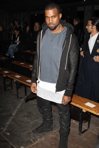 Rock 'N Rolla - Kanye West is living on the grungy edge in his faded black-and-gray and an off-white kilt (or is that a long undershirt?). He was spotted front row at the Givenchy Menswear Autumn/Winter 2013 show as part of Paris Fashion Week. (Photo: Antonio de Moraes Barros Filho/WireImage)