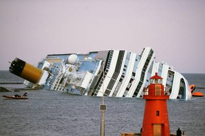More Bodies Found Aboard Costa Concordia as Fuel Pumping to Start - As Italian authorities scheduled the pumping of fuel from the toppled cruise ship for later this week, rescue workers found the bodies of two women on the ship, bringing the death toll to 15.&nbsp;(Photo: Tullio M. Puglia/Getty Images)