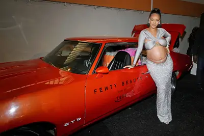 031422-style-maternity-fashion-rihanna-shines-bright-like-a-diamond-in-a-trendy-metallic-two-piece-with-a-matching-belly-chain-photo.jpg