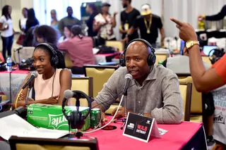 Just Chillin'  - Singer Kayla Brianna and former NBA player Kenny Smith get comfortable in the Radio Broadcast Center during the 2015 BET Experience. (Photo: Alberto Rodriguez/BET/Getty Images for BET)