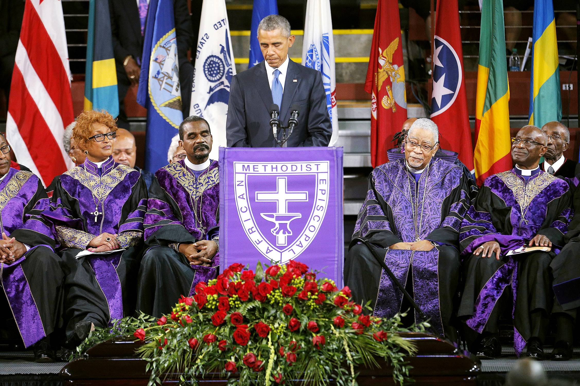 The President Speaks&nbsp; - President Obama eulogized Rev. Clementa Pinckney on Friday at College of Charleston's TD Arena to a crowd of thousands who came to pay their respects to the late pastor of the Emanuel AME Church in Charleston, S.C. &quot;Reverend Pinckney embodied a politics that was neither mean nor small,&quot; Obama said. &quot;He conducted himself quietly, and kindly, and diligently. He was full of empathy…able to walk in someone else’s shoes and see the world through their eyes.&quot; Following a message of grace throughout his speech, POTUS led the auditorium in song as he sang the chorus of &quot;Amazing Grace.&quot; Take a look at a few other moments from the service.&nbsp;(Photo: Brian Snyder /Landov)