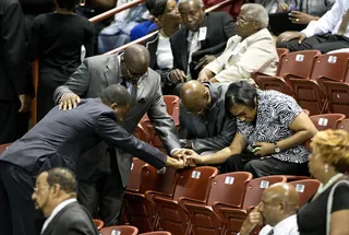 Praying for Strength - Mourners on Friday pray before the funeral service for Sen. Clementa Pinckney. (Photo: AP Photo/David Goldman)