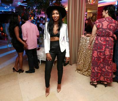 Time to Party - Singer Melanie Fiona keeps her ensemble semi-casual. The R&amp;B songstress paired up her blazer and nude pointed heels with a fun sun hat to add some flair to her formal attire. (Photo: Mark Davis/BET/Getty Images for BET)