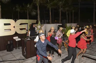 In Step - There’s nothing better than a group dance to set the mood. IFÉ-ILÉ had all the right steps to keep guests on their toes!(Photo: Gustavo Caballero/Getty Images for BET)