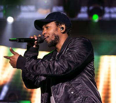 &quot;u&quot; - &quot;Loving you is complicated,&quot; Kendrick croons as if he's using an empty OE bottle –– or something 100 proof –– as a microphone. His voice, as distressed as the impending hangover this song leaves.(Photo: Angelo Merendino/Getty Images)