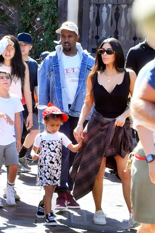 Disney Darling - North's Mickey Mouse dress was the perfect ensemble for a day at Disneyland celebrating her parent's second wedding anniversary.(Photo: Fern Sharpshooter / Splash News)