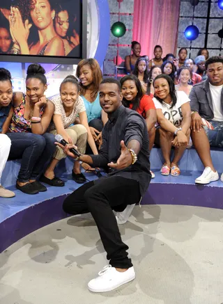Summertime Fly - Over the summer&nbsp;Luke James&nbsp;co-hosted 106 &amp; Park and rocked out in crisp white sneaks, his signature black skinny jeans, a navy blue button up shirt and some dope arm candy.(Photo: John Ricard / BET)