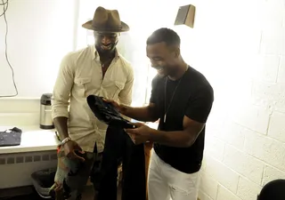 I like this - Luke James reviews wardrobe options in the green room at 106 &amp; Park, August 7, 2012. (Photo: John Ricard / BET)
