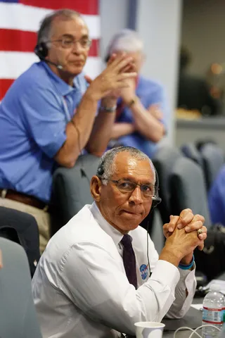 Tense Moment - NASA Administrator Charles Bolden clasps his hands as the rover begins its descent to the surface of Mars. (Photo: Brian van der Brug-Pool/Getty Images)