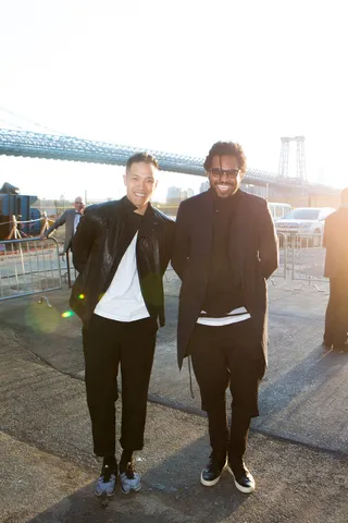 Trendsetters - Fashion designers Dao Yi Chow and Maxwell Osborne pose outside the Domino Sugar Factory with the Williamsburg Bridge as their backdrop.&nbsp;(Photo: Ryan Kobane, Courtesy of BMF Media)