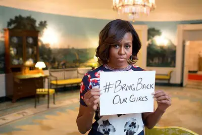 Hashtag Awareness - Waves of outraged individuals decried Shekau’s announcement and the abduction by supporting the #BringBackOurGirls hashtag campaign on social media, demanding the safe return of the young girls. #RealMenDontBuyGirls, a hashtag originally launched in 2011, was also revived.&nbsp;(Photo: Michelle Obama via Twitter)