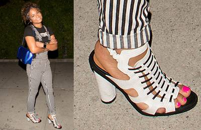 Christina Milian - We?d never think to pair striped overalls with a bold cutout sandal, but it?s totally working for Ms. Milian. (Photo: SPW / Splash News)
