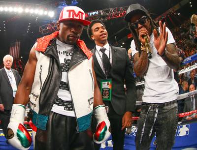 Theme Music - Lil Wayne&nbsp;provides the soundtrack for&nbsp;Floyd &quot;Money&quot; Mayweather Jr. as he enters the ring to fight Marcos Maidana at the MGM Grand Garden Arena in Las Vegas.(Photo: Ed Mulholland/Golden Boy/Golden Boy via Getty Images)