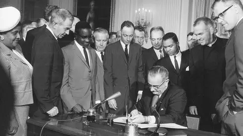President Lyndon B Johnson signs the Civil Rights Act in a ceremony at the White House, Washington DC, July 2, 1964 . (Photo by PhotoQuest/Getty Images)
