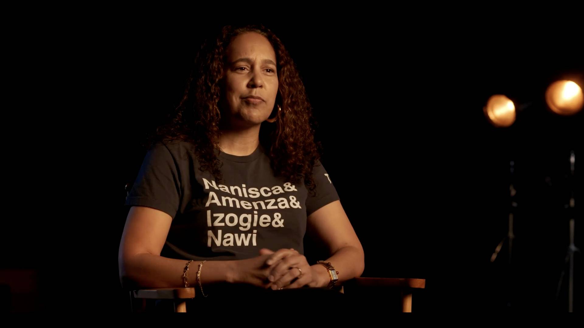 "The Woman King" director Gina Prince-Bythewood, in a black shirt, shares how she creates a safe space on set.