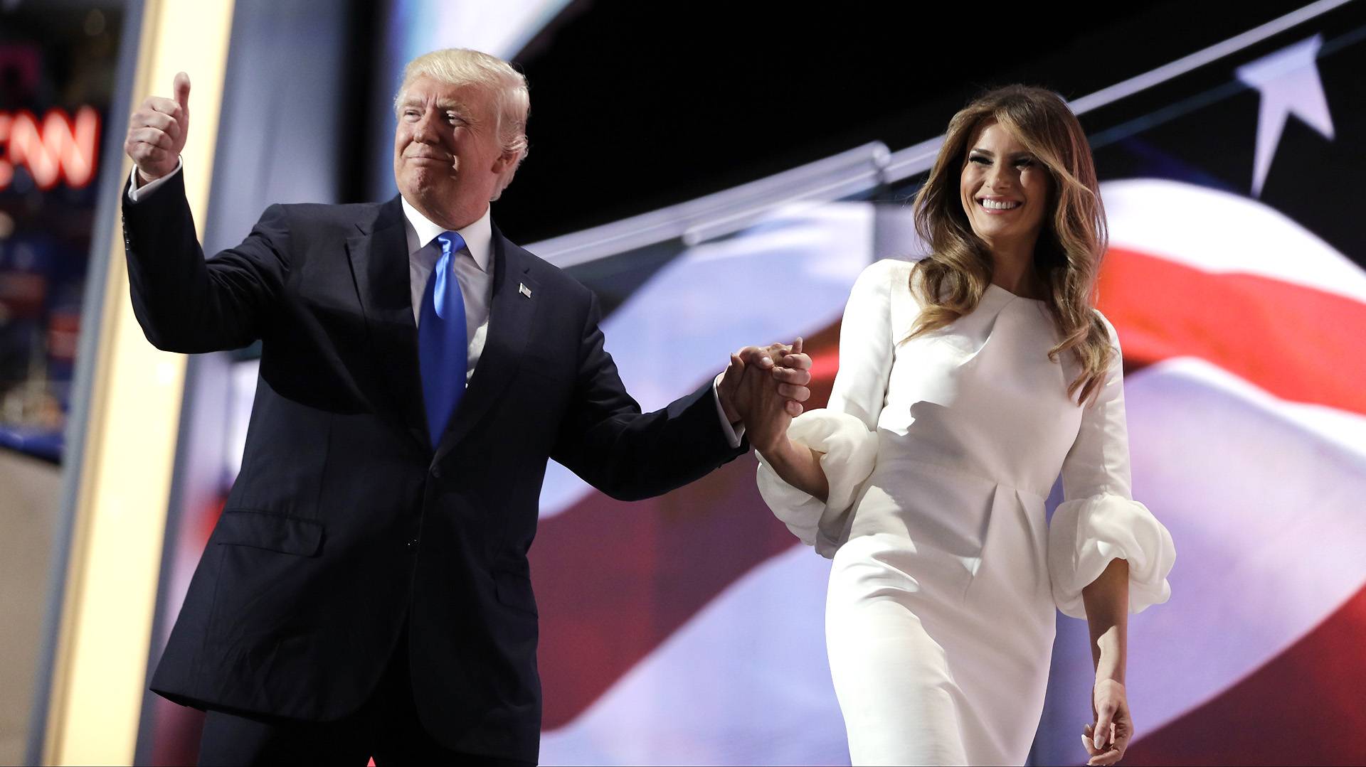 Republican presidential candidate Donald Trump gives his thumb up as he walks off the stage with his wife Melania during the Republican National Convention, Monday, July 18, 2016, in Cleveland. (AP Photo/John Locher)