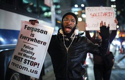 Ferguson Is Everywhere - A man takes part in a protest on Sixth Avenue in Manhattan after a grand jury decided not to indict New York Police Officer Daniel Pantaleo in Eric Garner's death on December 3, 2014 in New York City.&nbsp;(Photo: Kena Betancur/Getty Images)