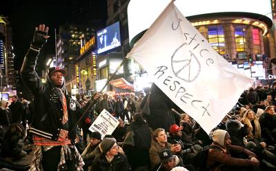 Where Is Justice for Eric Garner? - Protesters block traffic in Times Square during a march in response to the grand jury's decision in the Eric Garner case in New York.&nbsp;(Photo: AP Photo/Seth Wenig)