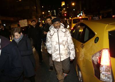 Spike Lee Joins In - Director Spike Lee marches with protesters through the streets in New York City.&nbsp;(Photo: AP Photo/Seth Wenig)