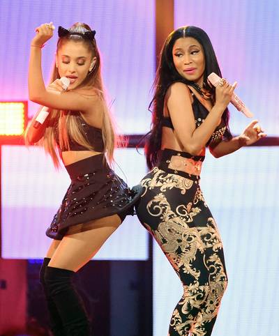 Nicki and Ari Get Down - Nicki Minaj and Ariana Grande joined Jessie J in creating one of the biggest hits of the year: &quot;Bang Bang.&quot; Nicki surprised fans at the iHeartRadio Music Festival by bringing out 21-year-old Ariana to perform the song with her, and this cute moment was captured for the cameras. &nbsp;(Photo: Ethan Miller/Getty Images for iHeartMedia)