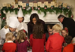 Cookie Time - The first lady helped military children decorate gingerbread cookies at the State Dining Room on Dec. 3.(Photo: Alex Wong/Getty Images)