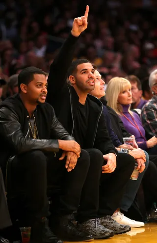 Baller Status - Rapper and Toronto Raptors team ambassador Drake&nbsp;enthusiastically takes in a game between the Raptors and the Los Angeles Lakers at Staples Center in Los Angeles.(Photo: Stephen Dunn/Getty Images)