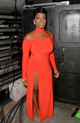 Vision In Red - Fantasia is nothing short of breathtaking in this fitted red dress with a high split. Talk about showing up and showing out!&nbsp;(Photo: Earl Gibson/BET/Getty Images for BET)