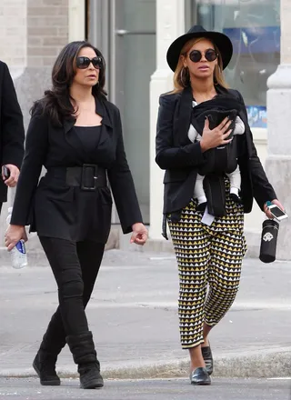 Generations - Beyoncé Knowles keeps her eyes on the paps as she and her mom, Tina Knowles, take baby Blue Ivy Carter for an afternoon stroll in New York City. The proud mom and grandmother look effortlessly chic during their walk. (Photo:CWNY/FameFlynet Pictures)
