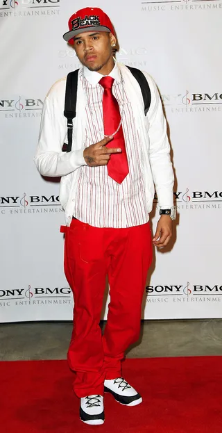 Back to School - Chris Brown takes us back to school on how to pair colors and patterns in this preppy red striped outfit.   (Photo: Alberto E. Rodriguez/Getty Images)