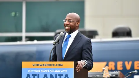 AUSTELL, GEORGIA - DECEMBER 20:  Raphael Warnock, U.S. Democratic Senate candidate, speaks during his Souls To The Polls Drive-In Rally at Riverside EpiCenter on December 20, 2020 in Austell, Georgia. (Photo by Paras Griffin/Getty Images)
