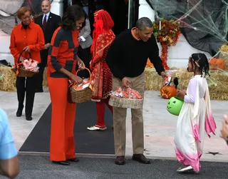And Who Are You Today? - The president and first lady greet a young trick-or-treater at the White House.(Photo: Mark Wilson/Getty Images)