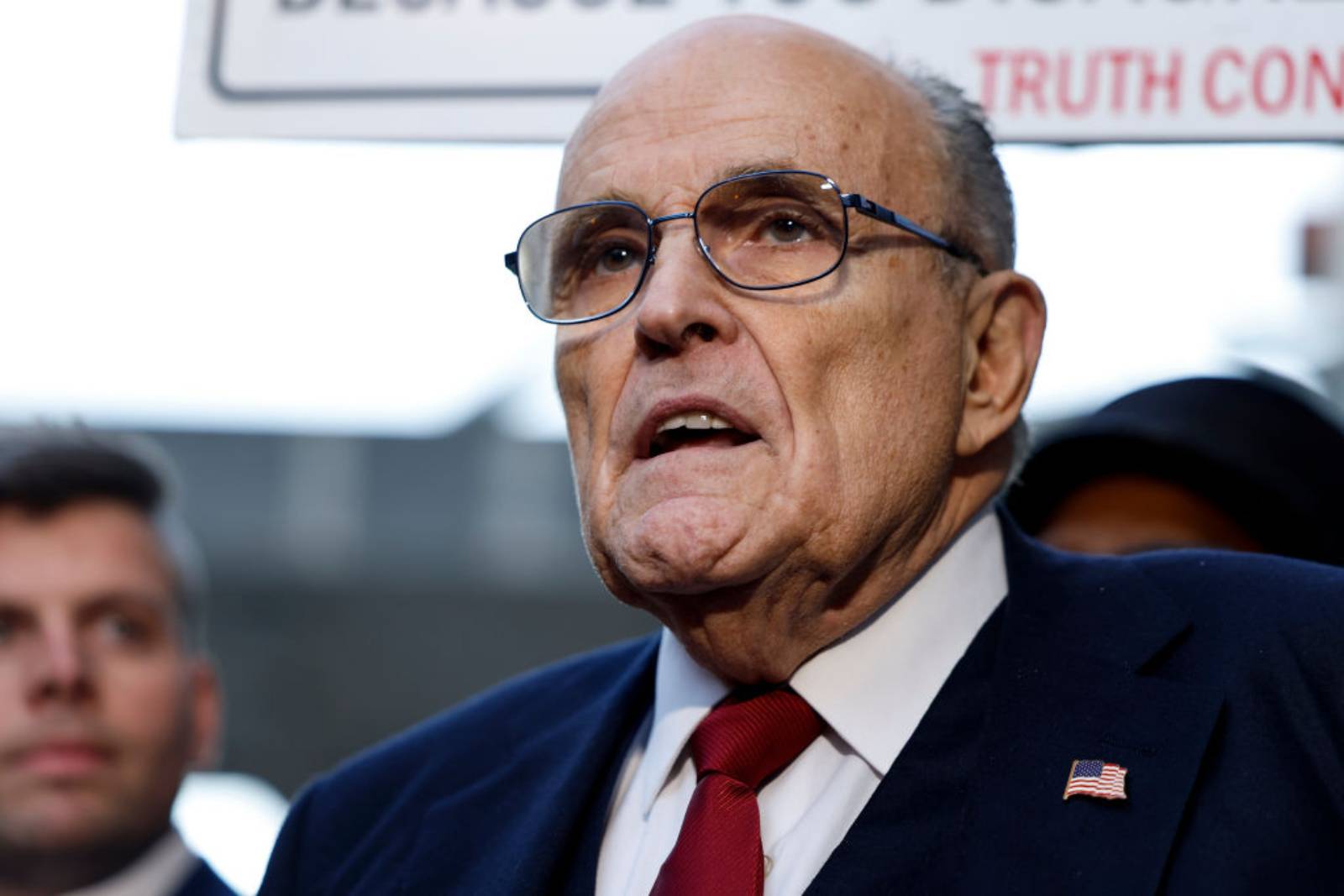 Rudy Giuliani, the former personal lawyer for former U.S. President Donald Trump, speaks with reporters outside of the E. Barrett Prettyman U.S. District Courthouse after a verdict was reached in his defamation jury trial on December 15, 2023 in Washington, DC. A jury has ordered Giuliani to pay $148 million in damages to Fulton County election workers Ruby Freeman and Shaye Moss. (Photo by Anna Moneymaker/Getty Images)