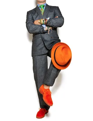 Accessorize - A gray tweed suit is anything but boring with the right accents. An orange felt hat and lace-up shoes take the look from sleepy to stylish.  (Photo: Jay Kos)