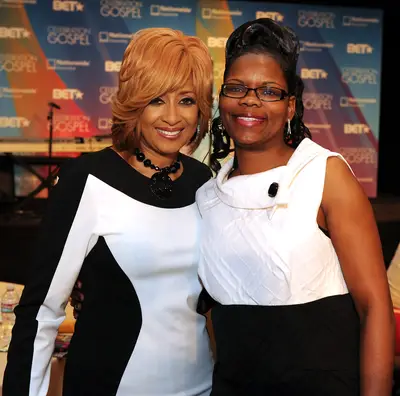 Black and White Color Block - Dorinda Clark-Cole poses with a fan at the prayer breakfast.. (Photo: Kevin Winter/Getty Images for BET)