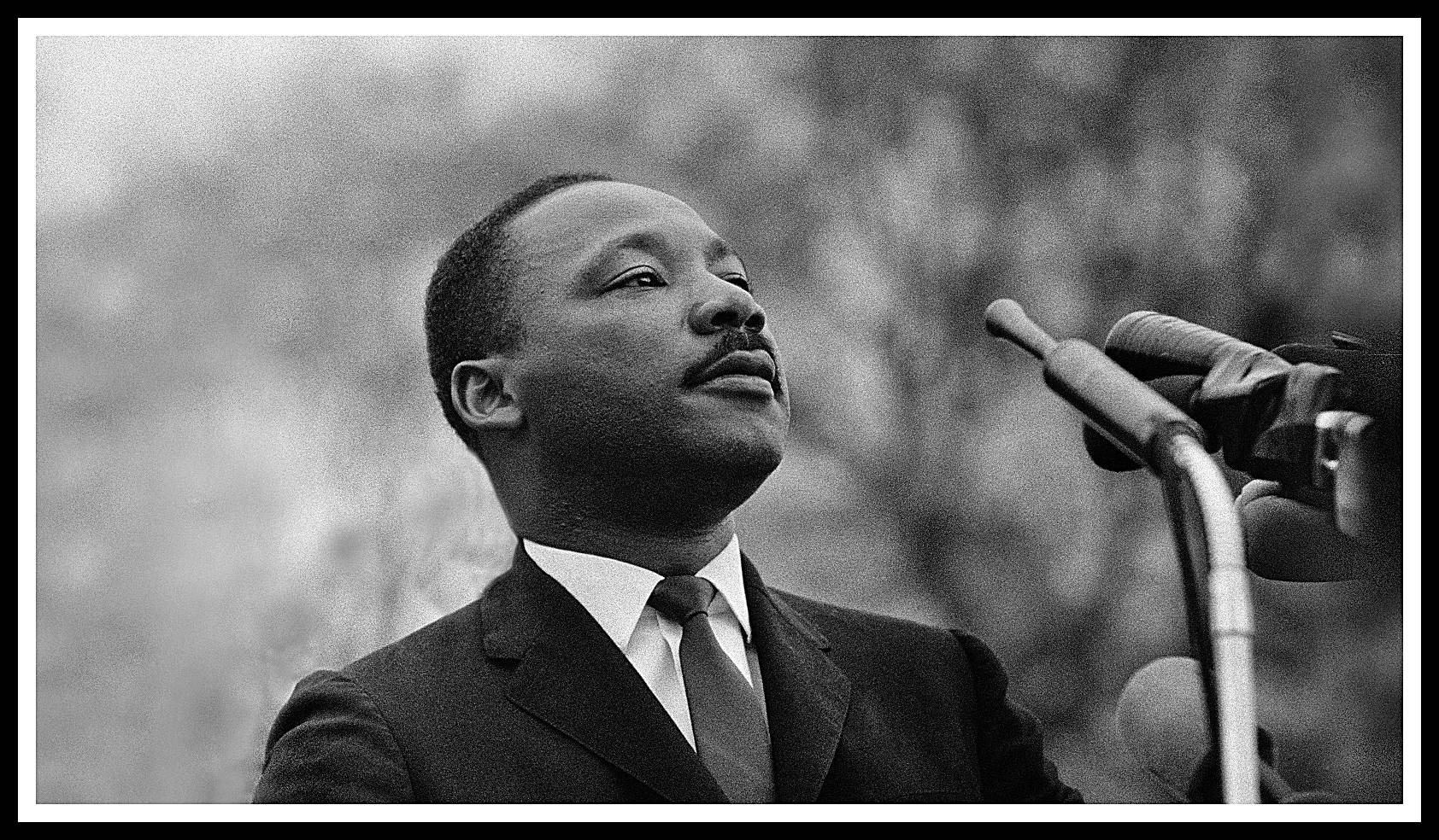 MONTGOMERY, AL - MARCH 25: Dr. Martin Luther King, Jr. speaking before crowd of 25,000 Selma To Montgomery, Alabama civil rights marchers, in front of Montgomery, Alabama state capital building. On March 25, 1965 in Montgomery, Alabama 