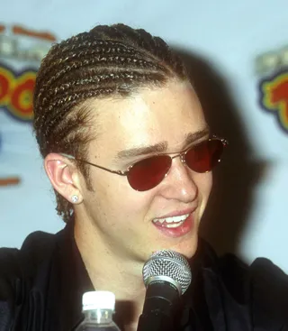 Justin Timberlake - The fellas aren't exempt. Before his &quot;Cry Me a River&quot; days, JT was in that &quot;awkward boy-band fashion&quot; phase, where he tried out the cornrows for a while. We don't think it's his best look, but, hey, it was the '90s.(Photo: Brenda Chase/Getty Images)