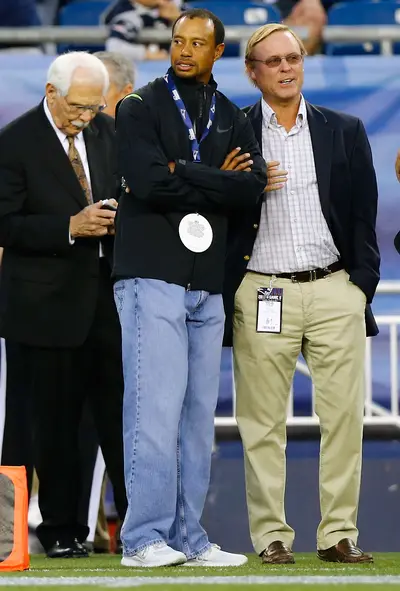 Tiger Woods  - We have to admit: dad jeans aren’t an easy look to pull off, but it is refreshing to see Tiger Woods out of his golf shirts and slacks. The golfer is seen here on the New England Patriots sideline during a preseason match against the New York Giants.&nbsp;  (Photo: Jared Wickerham/Getty Images)