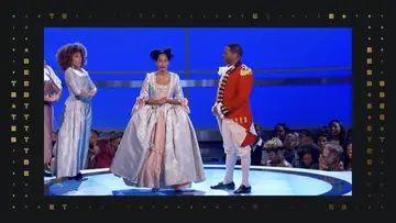 Tracee Ellis Ross and Anthony Anderson on stage in old timey outfits on stage.