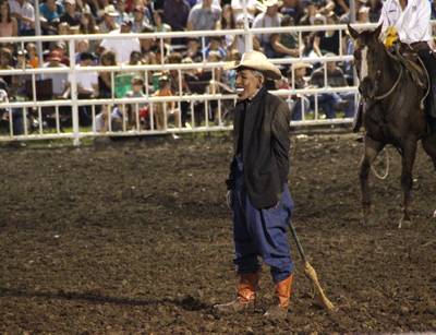 Clowning Around - A rodeo clown at the Missouri State Fair donned an Obama&nbsp;&quot;mask&quot; and challenged a bull to run him down.(Photo: AP Photo/Jameson Hsieh)